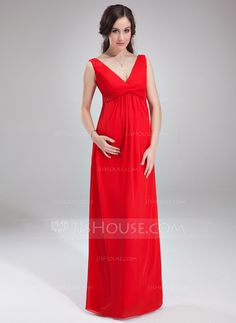 a woman in a red dress posing for the camera with her hands on her hips