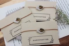 three handcrafted tags on top of an open book