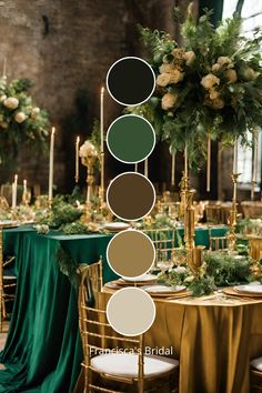 the table is set up with green and gold linens, greenery and candles