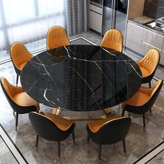 a black marble dining table surrounded by orange chairs