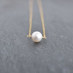 White pearls are so clean and classic. This 8mm white freshwater pearl is the perfect dainty size for casual every day look. On your choice of gold filled or sterling silver chain. This material will NOT tarnish, and can even get wet! Simple White Pearl Chain Jewelry, Simple White Pearl Drop Necklace, Minimalist White Beaded Pearl Necklace, Simple White Pearl Necklace For Everyday, Minimalist Single Strand Pearl Necklace For Anniversary, Everyday Pearl Necklace With Pearl Pendant, Minimalist Akoya Pearl Round Necklace, Everyday Pearl Necklace With Round Pearl Pendant, Minimalist Akoya Pearl Necklace