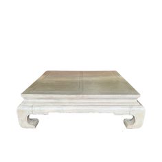 a white wooden table sitting on top of a white floor