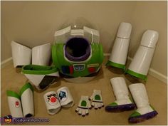 a green and white toy set sitting on the floor next to it's contents