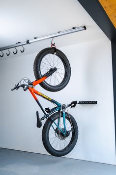 a bike is suspended upside down in the garage