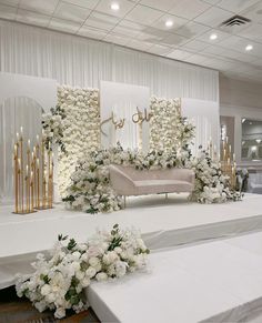 an elegant wedding setup with white flowers and candles