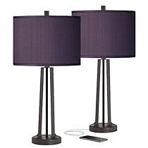 two lamps with purple shades are next to each other