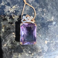 Size: 16mm x 29mm Chain: 42cm Metal Type: 14 k Gold   Weight: 10.4 grams Stones: Amethyst, Diamonds Diamonds: 0.1 ct. Cut: Single cut Clarity: Si Color: J Condition: Excellent Stunning amethyst and diamond Art Deco Pendant. The amethyst has a charming, magical  purple color and the altogether 0.1 ct. diamonds with J color and Si clarity compliment it very well. The pendant weighs 10.4 grams and is 29 mm long and 16 mm wide. The pendant has a stunning Art Deco design. This necklace  would be a pe Elegant Engraved Purple Necklace, Luxury Purple Jewelry For Collectors, Formal Engraved Purple Jewelry, Formal Purple Engraved Jewelry, Formal Amethyst Pendant Gemstone, Elegant Amethyst Rectangular Stone Jewelry, Gold Amethyst Jewelry With Diamond Accents, Elegant Amethyst Jewelry With Rectangular Stone, Purple Rectangular Jewelry For Formal Occasions