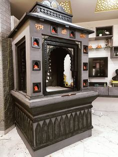 an elaborately designed shrine in the middle of a room