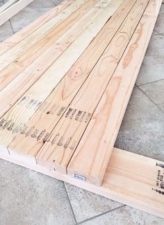 some wood is laying on the floor and ready to be used as a table top