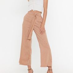 By Eight Paris From Nasty Gal. Never Worn, Excellent Condition. Wide Leg, Tie Front, High Waisted, Stretchy Waist Band. Pockets At Each Side. Light Brown With White/Cream Stripes. Blue Pants Shown For Fit. 10% Off 2+ Items When You Bundle! Reasonable Offers Always Welcome :) Please Keep In Mind Poshmark Takes A $2.95 Fee For Sales Under $15 And A 20% Fee For Sales Of $15 Or More White Bottoms With Tie Waist For Day Out, White Paperbag Waist Bottoms For Day Out, Spring Tie Waist Bottoms For Brunch, Spring Brunch Bottoms With Tie Waist, White Workwear Pants With Tie Waist, Chic Tie Waist Bottoms For Brunch, White Summer Pants With Tie Waist, White Tie Waist Trousers, White Trousers With Tie Waist