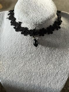 Add a touch of elegance to your outfit with this stunning Gothic Black floral necklace choker with pendant. The necklace features a beautiful heart-shaped pendant with intricate black lace details. The lobster closure ensures a secure fit, making it perfect for special occasions such as weddings, graduations, and birthdays.  This necklace is a great gift for your loved ones, whether it's for Mother's Day, Father's Day, Christmas, or Valentine's Day. Its unique design and Gothic theme make it a s Choker With Pendant, Gothic Theme, Gothic Themes, Floral Necklace, Necklace Choker, Beautiful Heart, Black Floral, Lace Detail, Black Lace