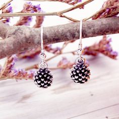 These earrings feature two lovely silver pine cones. They catch the light beautifully and the centre of each has been given a darker finish for added contrast. A matching pine cone pendant is also available: https://www.etsy.com/uk/listing/667141157/silver-pine-cone-necklace-handmade   ☆ I designed and sculpted the tiny pine cone digitally using 3D sculpting software. It was then 3D printed in resin and cast in sterling silver. Each item is individually hand finished in a small shop on the Corni Pine Cone Earrings, Pine Cone Pendant, Pinecone Necklace, 3d Sculpting, Pinecone Pendant, Winter Gift, Fall Jewelry, Pine Cone, Handmade Jewellery