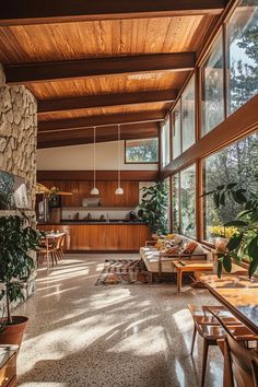 a living room filled with furniture and lots of windows