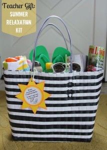 a black and white striped beach bag with flip flops