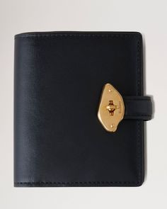 Lana Compact Wallet | Black High Gloss Leather | Women | Mulberry Small Designer Wallet, Luxury Bifold Wallet For Office, Luxury Bifold Wallet, Modern Compact Trifold Wallet For Formal Occasions, Modern Compact Wallets For Formal Use, Modern Compact Card Holder For Formal Use, Modern Compact Card Holder For Formal Events, Vintage Wallets For Women, Modern Wallets With Magnetic Closure