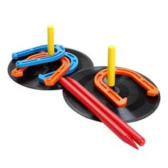 two toys that are sitting on top of each other in the shape of rings and arrows