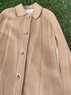 Fantastic original vintage cape, Design Weilemann Bern Creation Suisse, Switzerland 1980s. Beige wool cape. Featuring a long straight shape, front button closure, matching hand slits. This is a high quality cape made to survive the cold alpine climate and winter. Unique in its splendor. Excellent condition, like new. Our products can be used immediately without any problem, there is no dust, odor or anything like that. Dear customers, all the products in our shop are guaranteed to be 100% origin Bern Switzerland, Cape Designs, Vintage Cape, Wool Cape, Bern, Etsy Vintage, Cape, Like New, Jackets For Women