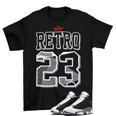 Retro 23 Jordan 13 Black Flint Sneaker Matching Tee Shirt  The unisex heavy cotton tee is the basic staple of any wardrobe. It is the foundation upon which casual fashion grows. All it needs is a personalized design to elevate things to profitability. The specially spun fibers provide a smooth surface for premium printing vividity and sharpness. No side seams mean there are no itchy interruptions under the arms. The shoulders have tape for improved durability. .: 100% cotton (fiber content may vary for different colors) .: Medium fabric (5.3 oz/yd² (180 g/m .: Classic fit .: Tear-away label .: Runs true to size Our custom designs are printed on Gildan t-shirts/sweatshirts. This is a custom item. We do not start production on this item until you make your purchase. *Please message us before Retro Black T-shirt For College, Basic Black T-shirt For College, Retro Letter Print Shirt For Streetwear, Retro Black Shirt With Text Print, Retro Text Print Shirt For Streetwear, Fan Apparel Letter Print Shirt For Streetwear, Jordan 13 Black Flint, Tshirt Layout, 23 Jordan