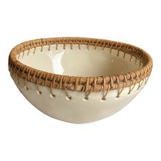 a white bowl with brown trim on the rim and handles, decorated with baseball stitching