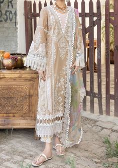 Tehzeeb by Riaz Arts introduces the embroidered Lawn collection for the festive season. This collection is a beautiful collection of ensembles offering versatile compositions for the latest festive wardrobe requirements. Embroidered Chikankari Lawn Front, Back, and Sleeves. Embroidered Chiffon Dupatta with Digital Printed Work. Dyed Cotton Trouser. Color: There might be slight color variation due to lighting and flashes while the photo shooting. The color may also vary because of different scree Pakistani Party Wear, Pakistani Fancy Dresses, Readymade Saree, Embroidered Chiffon, Chiffon Dupatta, Shalwar Kameez, Clothing Websites, Gold Threads, Model Pictures