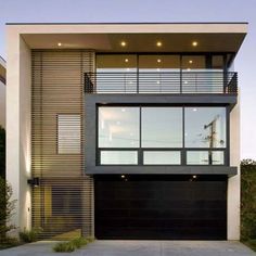 a modern house with an open garage door