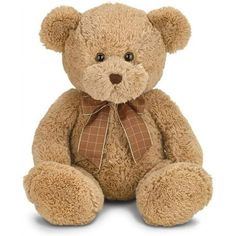 a brown teddy bear sitting on top of a white floor with a bow tie around it's neck