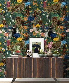 the wallpaper is very colorful and has many animals on it, as well as flowers