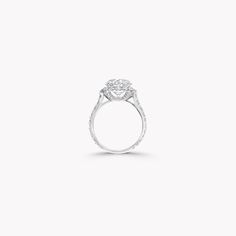 Inspired by Laurence Graff's life-long love of diamonds, our Icon setting engagement ring in white gold is designed to intensify the fire and luminosity of a Graff diamond, with the brilliance of the central round brilliant cut diamond enhanced by a gleaming pavé diamond halo. Each diamond in our engagement ring collection is individually crafted to accentuate its innate natural beauty, while each bespoke setting is shaped by our master craftsmen to cradle the unique silhouette of your selected Luxury Brilliant Cut Diamond Ring For Proposal, Luxury Halo Diamond Ring For Proposal, White Diamond Halo Solitaire Ring, Luxury Halo Design Diamond Ring For Proposal, White Gold Halo Ring With Brilliant Cut Lab-grown Diamond, White Gold Platinum Halo Ring For Proposal, Platinum White Gold Halo Ring For Proposal, Platinum Halo Ring With Asscher Cut Brilliant, Timeless Platinum Diamond Ring For Proposal