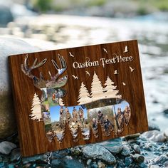 a wooden frame with photos of people and animals on it sitting next to some rocks