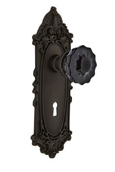 an ornate door handle with a keyhole on the front and back side of it