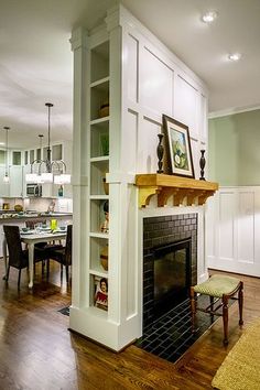 an image of a living room with fireplace and built in bookshelves