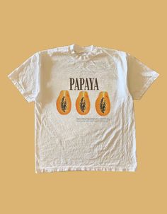 This Retro-Style Vintage Unisex T-Shirt is the perfect addition to your streetwear collection. This shirt features a vibrant and eye-catching Papaya Graphic, making it a must-have for both women and men with a love for unique and stylish clothing. Sizing reference ~ The Graphic Tees are true to size and are not oversized, please refer to the size guide that is attached as a photo on each post. For an oversized look, choose a size up ️ 🪩 Shipped from Australia for speedy delivery  T&C's - Please Streetwear Collection, Vintage Tee Shirts, Baby Graphic Tees, Oversized Graphic Tee, Graphic Tees Vintage, Trendy Prints, Vintage Graphic, Retro Shirts, Vintage Graphics