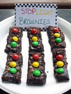 brownies with m & m candies are on a plate that says stoplight brownies