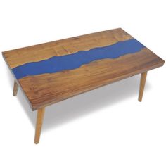 a wooden table with blue paint on it