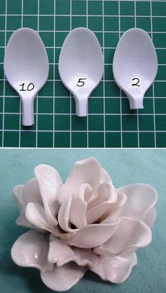 three spoons with flowers in them on a table