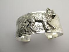 "Fox cuff bracelet Magnificent hand crafted fox cuff bracelet From MyElegantThings \"Angelina Verbuni Design Studio\" Antique silver plated over brass cuff. Cuff is an engraved with gorgeous vines. 1 inch width. Will fit 6 to 8 inches. Gorgeous and what a statement." Unique Cuff Bracelets For Gifts, Unique Cuff Bracelet For Gift, Bridal Hair Ornaments, Art Deco Inspired Jewelry, Large Cuff Bracelet, Fox Jewelry, Vintage Hair Clips, Vintage Fox, Brass Cuff