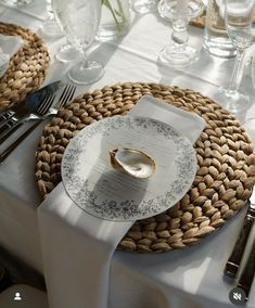 a table set with place settings and silverware