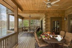 a porch with tables and chairs on it