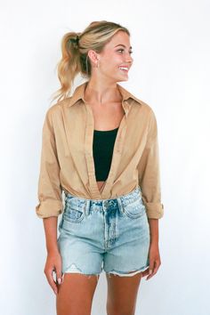 Oversized khaki boyfriend shirt. This oversized shirt can be styled a million different ways. Throw it on over a white tee and jeans for a relaxed and easygoing look, or dress it up with the matching shorts for a set that's perfect for Fall. With its comfortable and relaxed fit, this shirt is a must-have for your Fall wardrobe. White Tee And Jeans, Boyfriend Shorts, Boyfriend Shirt, Matching Top, White Tee, Fall Wardrobe, Oversized Shirt, Must Haves, Relaxed Fit