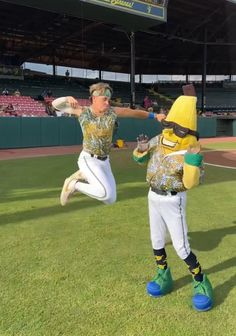 two people dressed in baseball uniforms and banana costumes