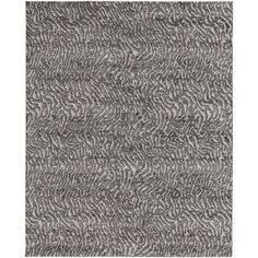 a gray rug with wavy lines on the top and bottom, in different sizes and colors