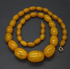 "Beautiful Estate Vintage Semicrome Tested Bakelite Yellow Butterscotch Amber Large Bead Necklace with gold filled clasp good pre/owned condition measures 22\" length and weight 70 grams." Vintage Yellow Gold Polished Bead Necklace, Vintage Yellow Gold Necklaces With Polished Beads, Vintage Yellow Gold Necklace With Polished Beads, Vintage Yellow Gold Beaded Necklace, Vintage Oval Necklace With Polished Beads, Large Bead Necklace, Natural Amber, Purple Rhinestone, Amber Necklace