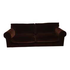 a brown couch sitting on top of a white wall