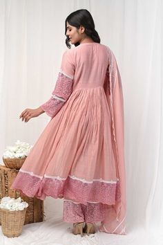 Dusty peach three fourth sleeves Aliya cut gathered anarkali with floral lace detailing on the yoke,hem and bloom embroidery on the sheer sleeves. Paired with a floral embroidered sheer hem pant and lace embellished scallop hem dupatta. - Aza Fashions Traditional Pink Anarkali Set For Spring, Pink Long Sleeve Anarkali Set For Spring, Semi-stitched Anarkali Set In Lace, Peach Anarkali Set With Straight Kurta, Pink Chikankari Embroidery Anarkali Set For Spring, Pink Anarkali Set With Chikankari Embroidery For Spring, Pink Chikankari Anarkali Set For Spring, Peach Anarkali Kurta, Jaipur Anarkali