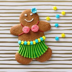 there is a cookie decorated to look like a ginger with grass skirt and flowers on it