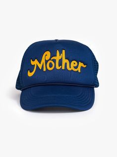 a blue trucker hat with the word mother written in yellow on it, against a white background