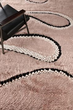 a chair sitting on top of a shaggy rug