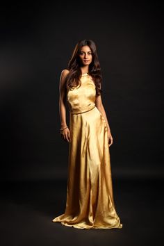 Dress to impress this season with this luxurious golden chardonnay gown! Crafted from cupro satin, its halter neckline adds a touch of opulence that will make you stand out at any soirée. Show off your style and elegance while making an unforgettable entrance with this must-have evening wear!Details Neckline: Halter neck Material: Cupro satin Lining: Cotton-polyester Made in India What makes this outfit sustainable?This outfit is made with cupro satin; the fabric is made from cotton linter waste. It is a sustainable alternative to polyester. Gold Satin, Just Peachy, Chardonnay, Halter Neckline, Beauty Bag, Beauty Essentials, Active Wear Tops, Halter Neck