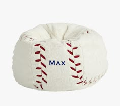 a white bean bag with red stitching on it and the word max written in blue