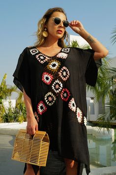 Casual Multicolor V-neck Cover-up, Casual Black Stretch Cover-up, Black Stretch Casual Cover-up, Casual V-neck Cover-up For Day Out, V-neck Rayon Top For The Beach, Chic Multicolor V-neck Cover-up, Bohemian V-neck Cover-up, Black Split Neck Tops For Summer, Trendy V-neck Spring Cover-up